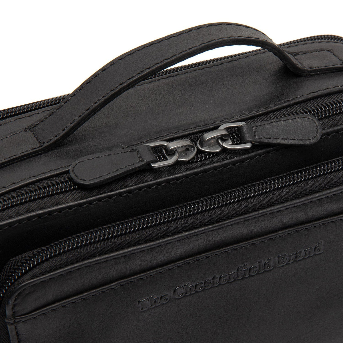 
Solid Antique Brass Hardware & Heavy-Duty Dual Zipper Detail on Rovon Шкіряна сумка через плече